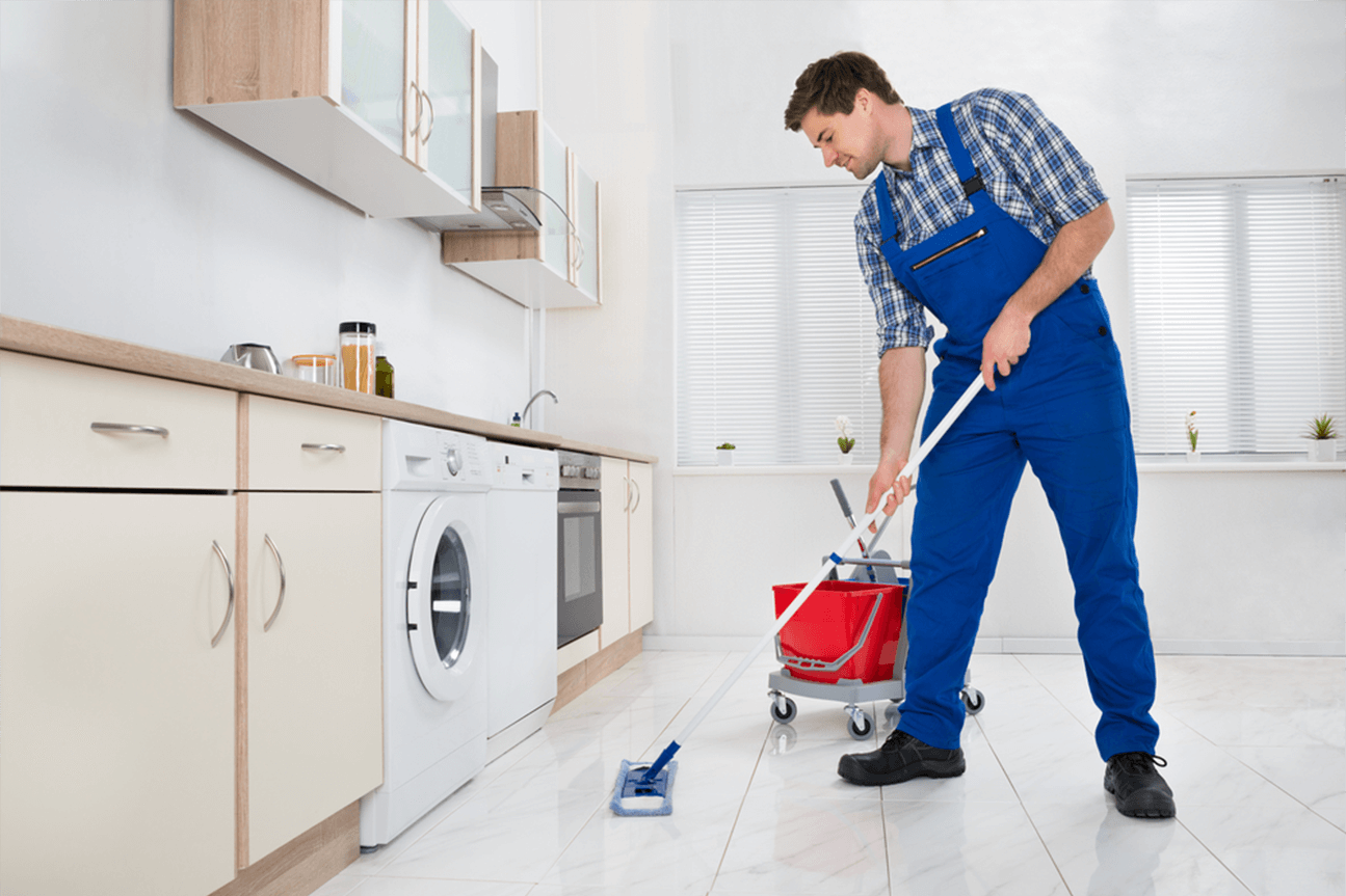 Cleaner working in a residential kitchen